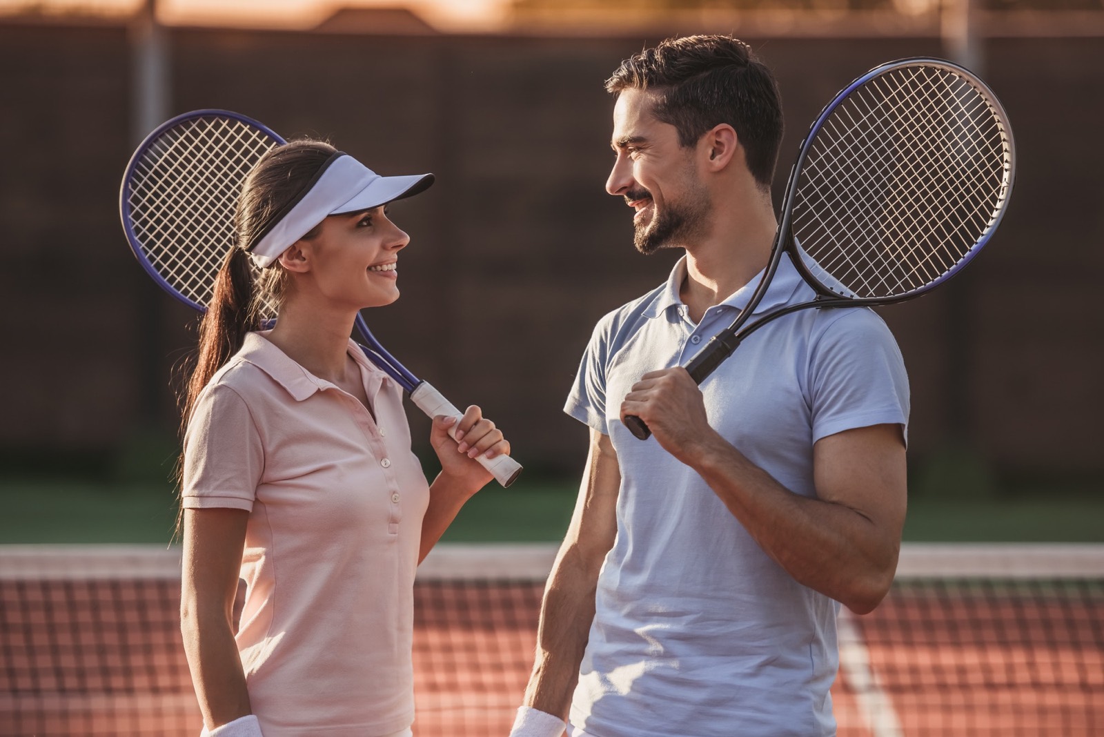 A small group enjoying a friendly tennis lesson together